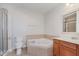 Bathroom features tub, shower, toilet and vanity with sink at 355 E Ohio St # 209, Indianapolis, IN 46204