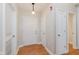 Apartment entry with hardwood floors and multiple doors for storage and access at 355 E Ohio St # 209, Indianapolis, IN 46204