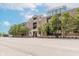 Street view of a stylish condominium building with manicured landscaping at 355 E Ohio St # 209, Indianapolis, IN 46204