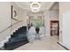 Elegant building lobby featuring modern lighting, stylish staircase, and elevator access at 355 E Ohio St # 209, Indianapolis, IN 46204
