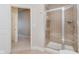 Bathroom featuring a shower with glass door and a bench at 355 E Ohio St # 209, Indianapolis, IN 46204