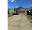 Charming one-story home with a brick facade, two-car garage, and a well-maintained front yard at 3682 Lace Bark Dr, Indianapolis, IN 46235