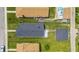 An aerial view showcases the home's dark roof and backyard, nestled among neighborhood properties and green lawns at 3906 Fletcher Ave, Indianapolis, IN 46203