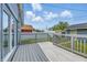 Wooden deck with a view to a white fence, and a beautiful blue sky at 3906 Fletcher Ave, Indianapolis, IN 46203
