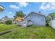 Backyard view with grassy space and access to deck at 3906 Fletcher Ave, Indianapolis, IN 46203