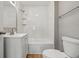 Bathroom featuring a toilet, tub/shower combo, vanity and modern finishes at 3906 Fletcher Ave, Indianapolis, IN 46203
