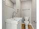 Modern half-bathroom with a sleek sink, contemporary fixtures, and a clean design at 3906 Fletcher Ave, Indianapolis, IN 46203