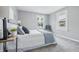 Cozy bedroom featuring two windows, neutral colors, and stylish décor at 3906 Fletcher Ave, Indianapolis, IN 46203