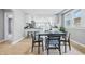 Bright dining room with modern table and chairs, flowing into the kitchen area at 3906 Fletcher Ave, Indianapolis, IN 46203