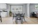 Bright dining room with modern table and chairs, flowing into the kitchen area at 3906 Fletcher Ave, Indianapolis, IN 46203