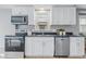 Updated kitchen with white cabinets, stainless steel appliances, and modern fixtures at 3906 Fletcher Ave, Indianapolis, IN 46203