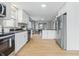 Modern kitchen featuring stainless steel appliances, granite countertops, and ample cabinet space at 3906 Fletcher Ave, Indianapolis, IN 46203