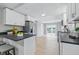 Modern kitchen featuring stainless steel appliances, granite countertops, and ample cabinet space at 3906 Fletcher Ave, Indianapolis, IN 46203