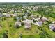 Aerial view of a neighborhood with tree-lined streets, well-maintained lawns, and a peaceful setting at 4017 Ivory Ct, Carmel, IN 46074