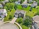 Aerial view of brick home with lush lawns, pond, mature trees, and a cul-de-sac at 4017 Ivory Ct, Carmel, IN 46074