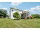 Expansive backyard featuring a screened porch and well-maintained lawn at 4017 Ivory Ct, Carmel, IN 46074