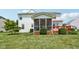 Spacious backyard featuring a screened porch and deck, surrounded by lush greenery, offering relaxation and privacy at 4017 Ivory Ct, Carmel, IN 46074