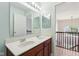Well-lit bathroom featuring double sinks, a large framed mirror, and light colored flooring at 4017 Ivory Ct, Carmel, IN 46074
