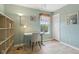 Well-lit bedroom/office flex space with large window, light colored wooden flooring, and modern décor at 4017 Ivory Ct, Carmel, IN 46074