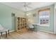 Brightly lit flex-space featuring a ceiling fan, a window overlooking the backyard, and a light colored wooden floor at 4017 Ivory Ct, Carmel, IN 46074