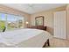 Inviting bedroom features a large window and a well-appointed dresser with a mirror at 4017 Ivory Ct, Carmel, IN 46074
