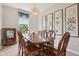 Bright dining room with chandelier lighting, traditional decor, and wall art at 4017 Ivory Ct, Carmel, IN 46074