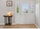 Inviting foyer with a decorative glass front door, stylish table, and elegant accents at 4017 Ivory Ct, Carmel, IN 46074