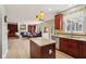 Open concept kitchen view with granite counters, an island, and a clear view to the living room at 4017 Ivory Ct, Carmel, IN 46074