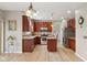 Spacious kitchen features stainless appliances, granite counters, an island, and open floor plan at 4017 Ivory Ct, Carmel, IN 46074