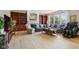 Open living room with fireplace, built-in bookshelves, large windows, and hardwood floors at 4017 Ivory Ct, Carmel, IN 46074
