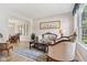 Cozy living room featuring elegant furnishings, a decorative rug, and ample natural light at 4017 Ivory Ct, Carmel, IN 46074