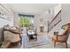 Inviting living room with classic furniture, a large window, and an open view of the foyer at 4017 Ivory Ct, Carmel, IN 46074