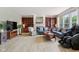 Spacious living room featuring a fireplace, built-in shelving, and hardwood floors at 4017 Ivory Ct, Carmel, IN 46074