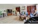 Cozy living room featuring a fireplace, built-in bookshelves and natural light at 4017 Ivory Ct, Carmel, IN 46074