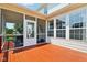 Well-maintained rear deck connected to the screened porch, providing outdoor space for relaxation and entertainment at 4017 Ivory Ct, Carmel, IN 46074