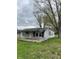 Modest home featuring a quaint covered porch supported by wooden columns and a simple facade at 4206 Clark St, Anderson, IN 46013