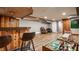 Spacious basement featuring a wooden bar, dartboard, and an entertainment area at 4415 N Illinois St, Indianapolis, IN 46208