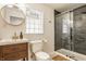 Modern bathroom with glass enclosed shower, wood vanity, and stylish fixtures, designed for both functionality and aesthetics at 4415 N Illinois St, Indianapolis, IN 46208