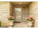 Inviting front entrance with decorative flower pots and clear house number display at 4415 N Illinois St, Indianapolis, IN 46208