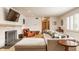 Bright living room with fireplace, hardwood floors, and a cozy seating arrangement at 4415 N Illinois St, Indianapolis, IN 46208