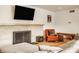 Bright living room featuring a stone fireplace and hardwood floors at 4415 N Illinois St, Indianapolis, IN 46208