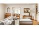 Sunlit living space with stylish decor, hardwood floors, and views to the dining area at 4415 N Illinois St, Indianapolis, IN 46208