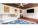 Bright sunroom featuring a ceiling fan, tiled floors, and a comfortable seating area for relaxation at 4415 N Illinois St, Indianapolis, IN 46208