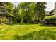 Lush backyard features an expansive lawn, perfect for outdoor activities at 4428 Edinburgh Pt, Indianapolis, IN 46228