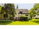A well-manicured backyard featuring a wooden deck and lush green lawn at 4428 Edinburgh Pt, Indianapolis, IN 46228