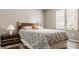 Comfortable bedroom with a patterned bedspread and natural light at 4428 Edinburgh Pt, Indianapolis, IN 46228