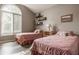 Cozy bedroom with matching twin beds and unique arched window at 4428 Edinburgh Pt, Indianapolis, IN 46228