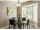 Breakfast nook features bay window, seating for four and stylish lighting at 4428 Edinburgh Pt, Indianapolis, IN 46228