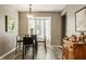 Breakfast nook with bright window features seating for four and view to the kitchen at 4428 Edinburgh Pt, Indianapolis, IN 46228