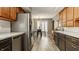 Spacious kitchen with stainless steel refrigerator and dishwasher with breakfast nook in background at 4428 Edinburgh Pt, Indianapolis, IN 46228